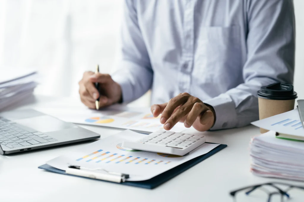 Professional accountant consulting client in Melbourne office for financial planning