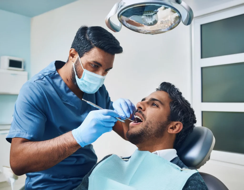 Dentist providing treatment to patient in Sydney dental clinic