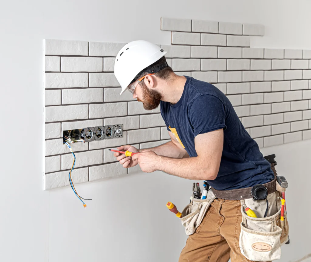 Licensed electrician working on electrical wiring in Brisbane residential property