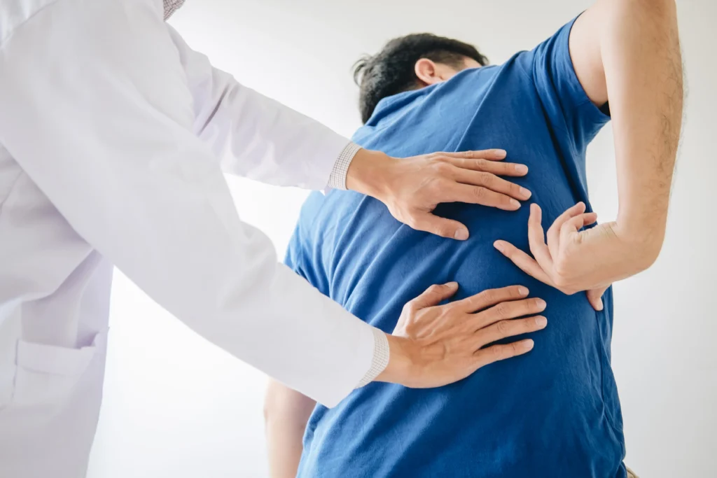 Chiropractor providing spinal adjustment treatment in Adelaide clinic