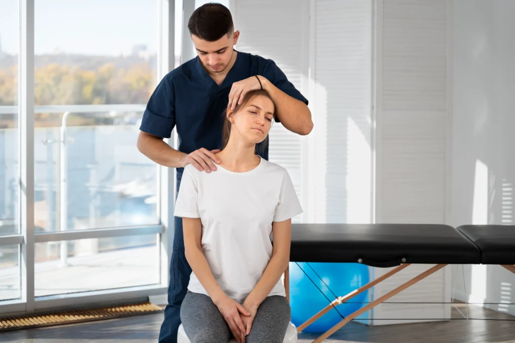 Chiropractor providing spinal adjustment treatment in Brisbane clinic