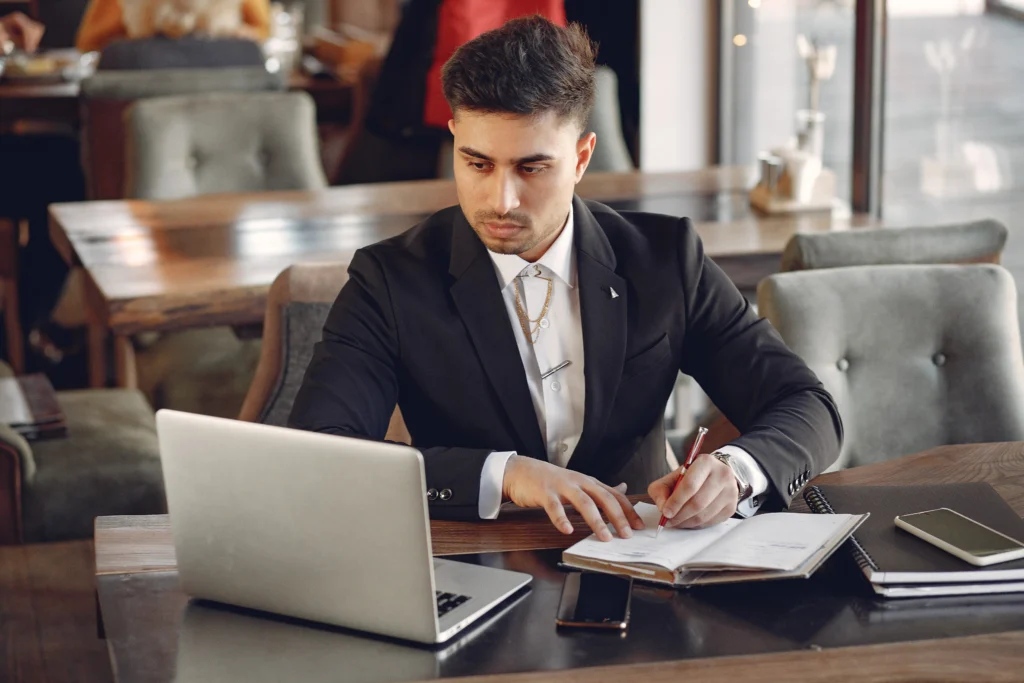 Professional accountant consulting client in Sydney office for financial planning