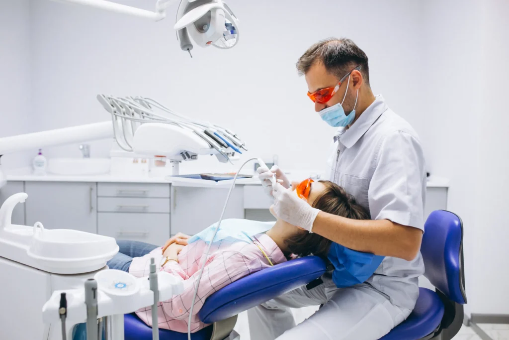 Dentist providing treatment to patient in Brisbane dental clinic