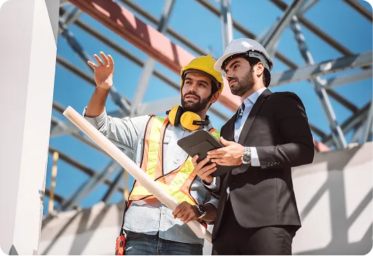 shows two individuals discussing a construction project,