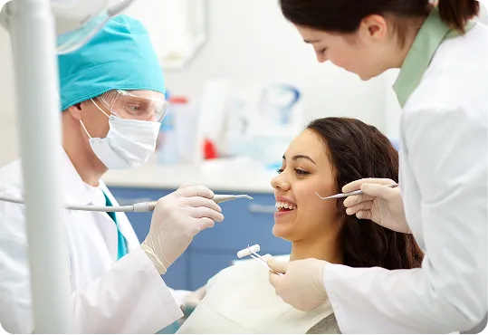 dentist and an assistant wearing professional attire