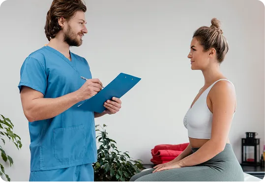 healthcare professional in blue scrubs conducting a consultation