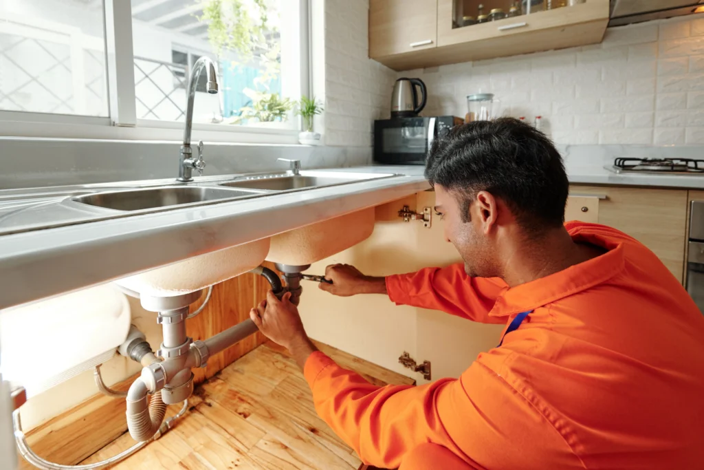 Adelaide plumber fixing bathroom sink Google Ads PPC marketing services for plumbers