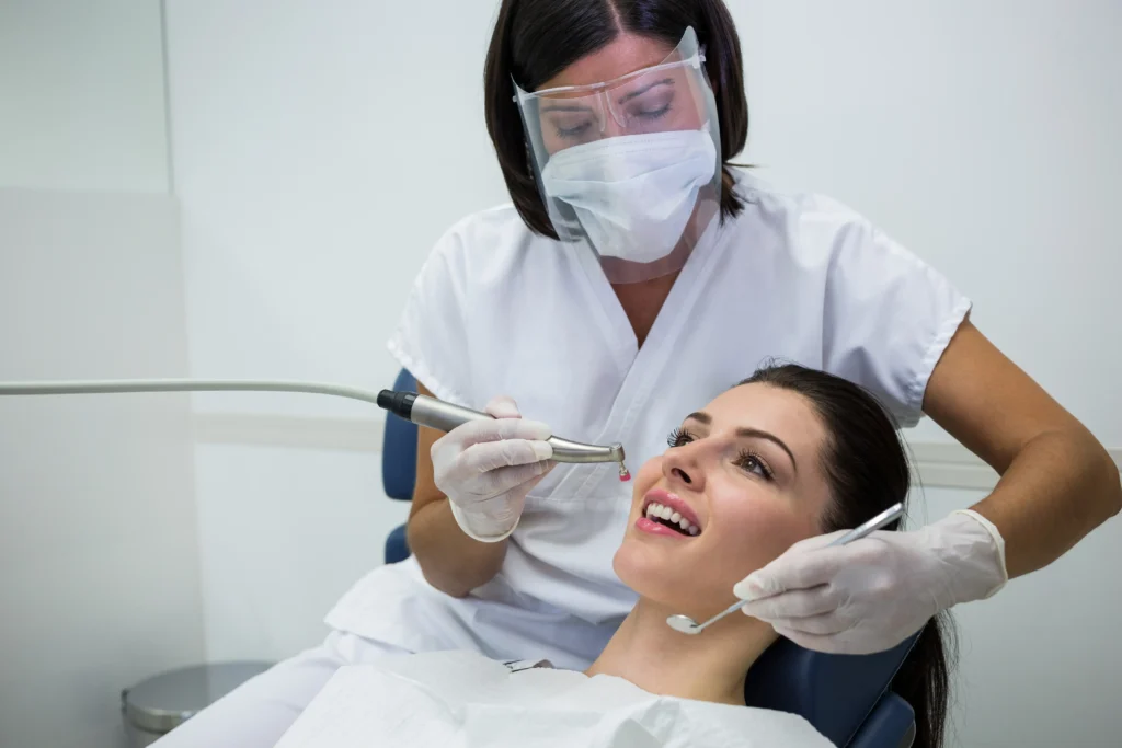 dentist in Hobart treating patient in modern dental clinic website design for dentists