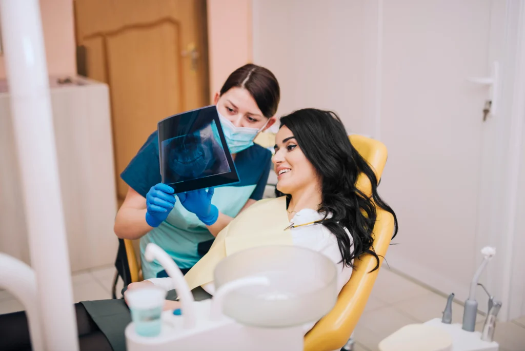 dentist in Perth clinic with branded marketing materials graphic design for dental practices