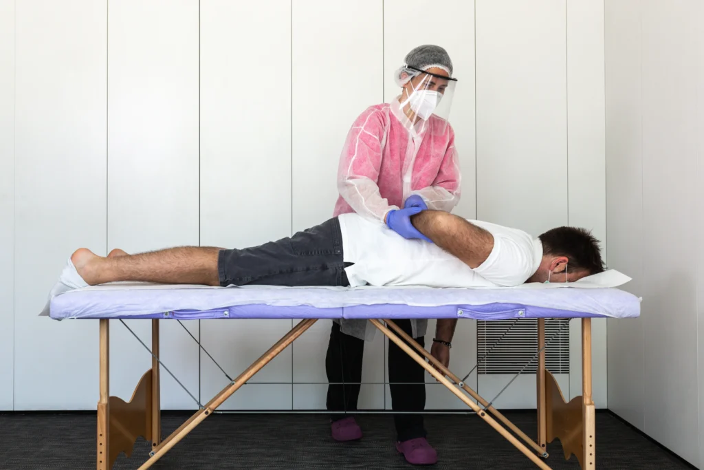 chiropractor in Sydney clinic using mobile app for patient appointments and treatment plans app development for chiropractic clinics