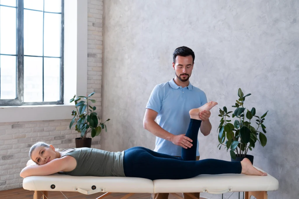 physiotherapist in Sydney clinic with branded brochure and business card graphic design for physiotherapy clinics