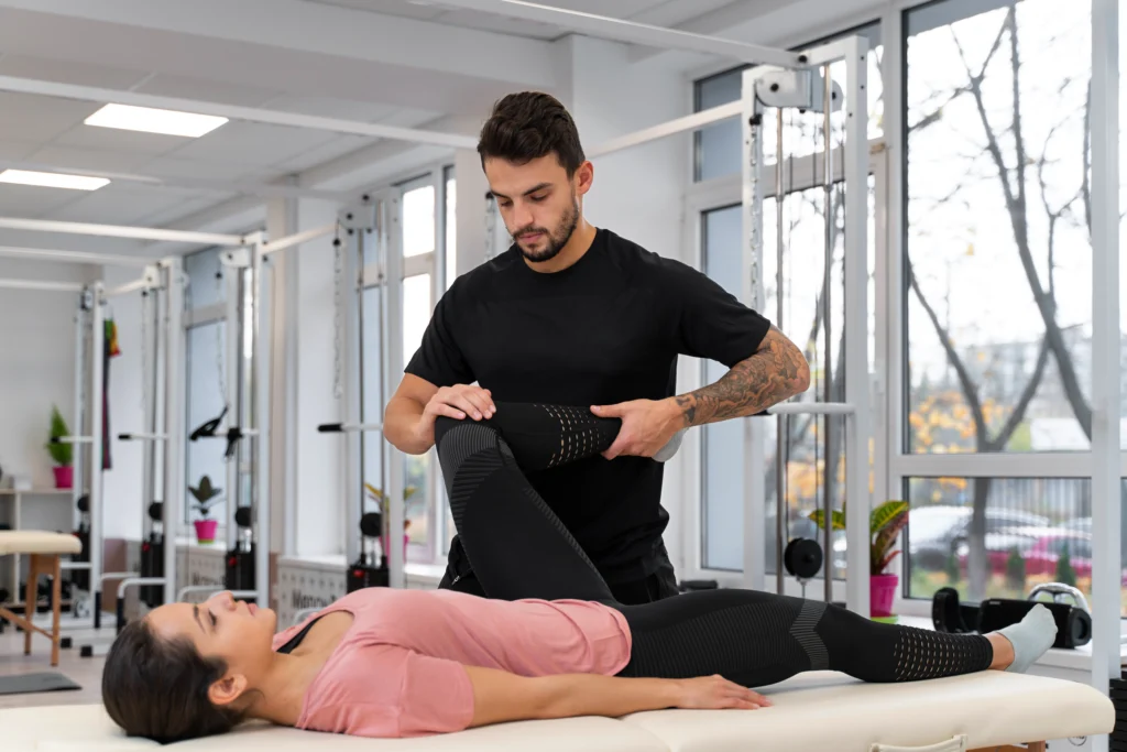 physiotherapist in Brisbane clinic with branded brochure and business card graphic design for physiotherapy clinics