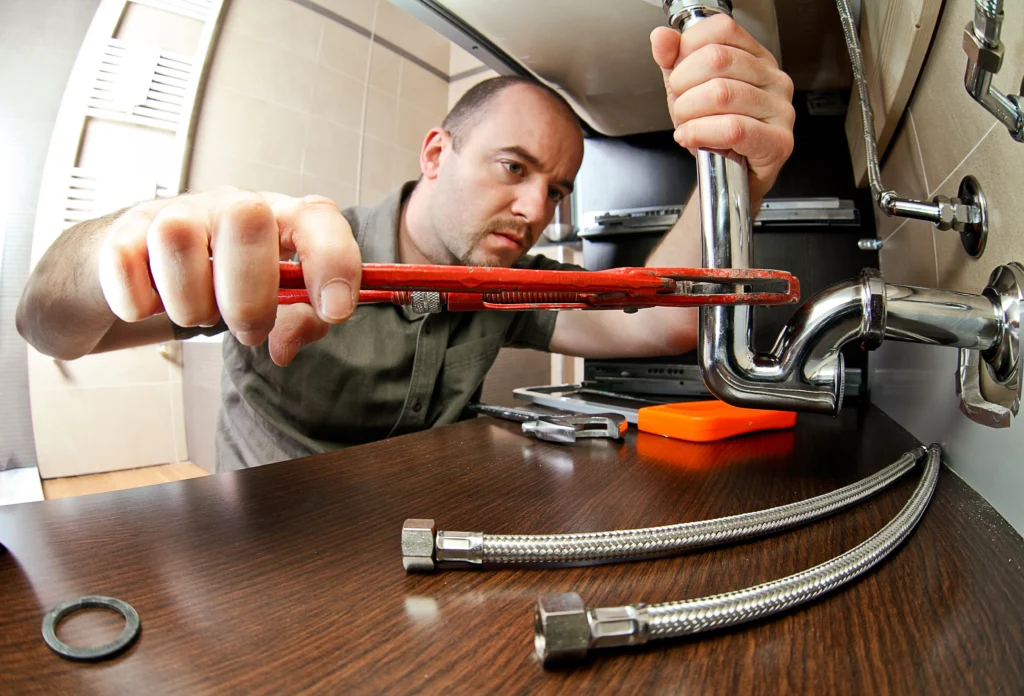 plumber in Perth repairing pipe PPC advertising for plumbing services