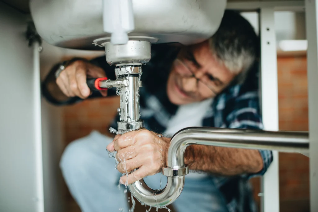 Hobart plumber fixing bathroom sink Google Ads PPC marketing services for plumbers