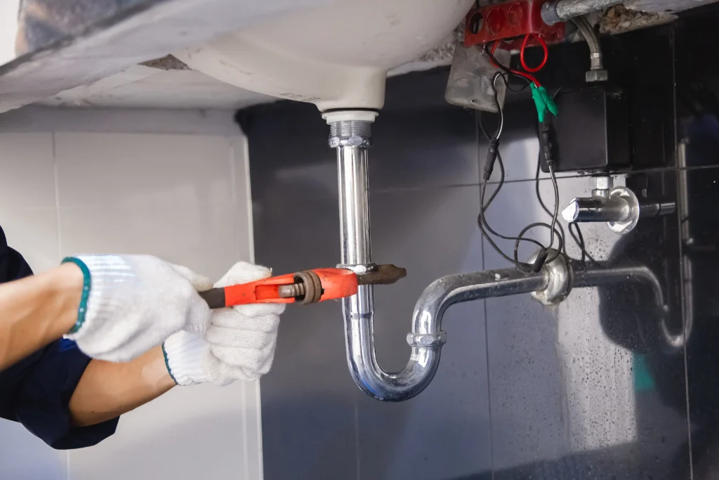 plumber in Hobart repairing pipe PPC advertising for plumbing services