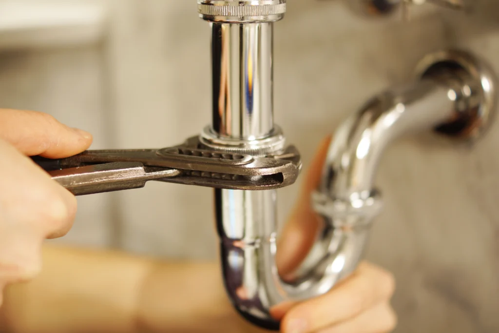 plumber in Brisbane with branded van and uniform graphic design for plumbing business