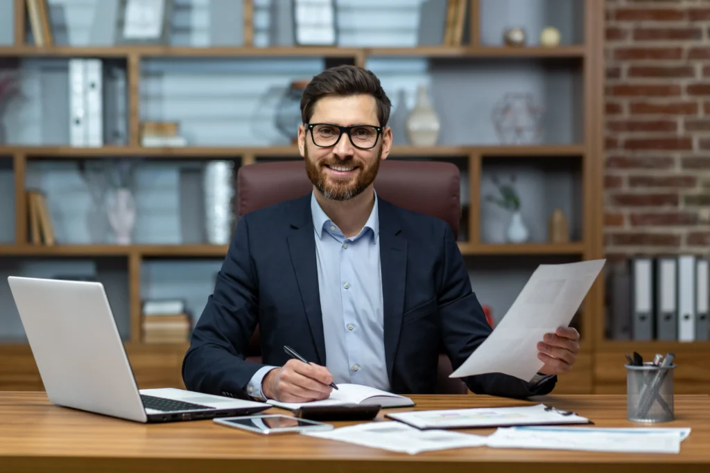 Professional accountant consulting client in Perth office for financial planning
