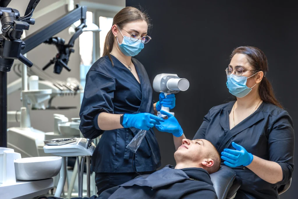 dentist in Sydney clinic with branded marketing materials graphic design for dental practices
