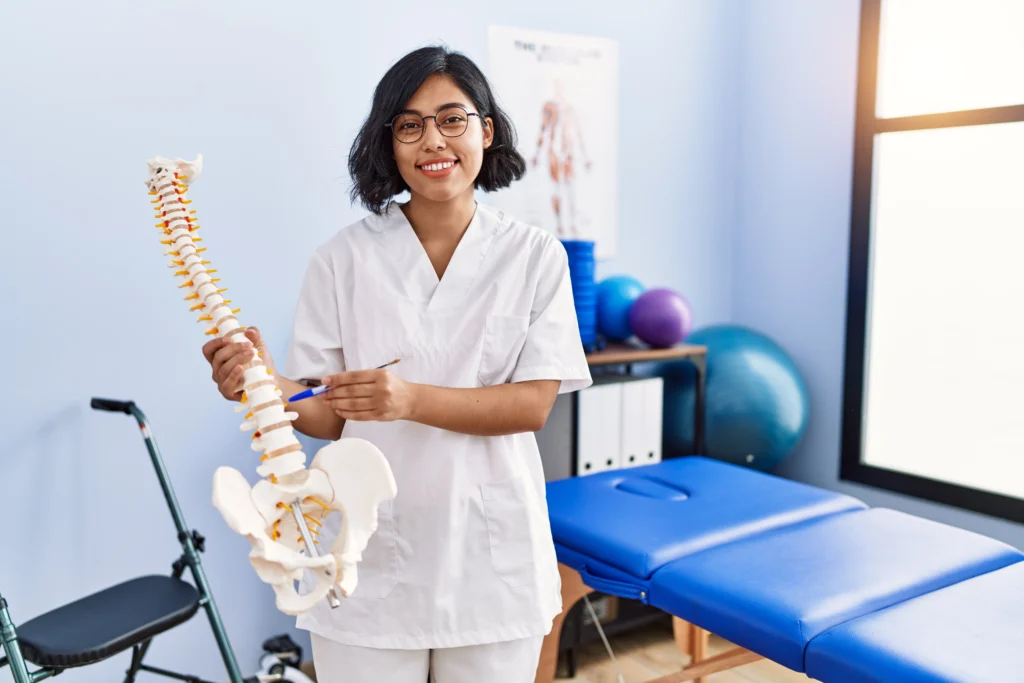 chiropractor in Melbourne clinic with branded brochure and business card graphic design for chiropractic clinics